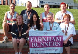 Some of the Farnham Runners with their medals after the 2009 London Marathon