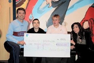 Andrew Ellison presenting cheque from money raised at the 2012 Alice Holt Races to Disability Challengers