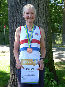 Jane Georghiou with her 10000m bronze medal and certificate at the 2012 European Veterans’ Track and Field Championships