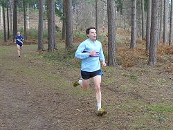 Andrew Ellison running through woods at 2012 TRXCL race in Farnham