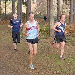 Ian Carley and others running through Bourne Woods in the 2013 SXCL race at Farnham