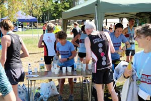 Team giving out drinks and bananas at the end of the race