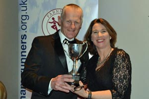 Paul Tucker with Handicap trophy being presented by Jacquie Browne