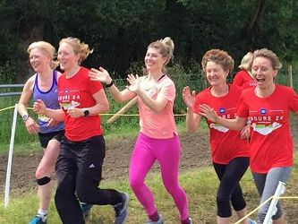 3rd placed Farnham Runners ladies team approaching the finish