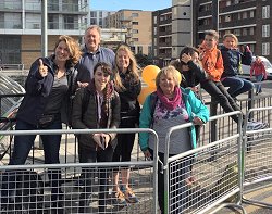 Farnham Runners supporters by the barriers waiting for the runners