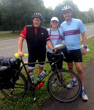 Richard Sheppard holding bike standing beside Cyra Parkes and Ian Calder