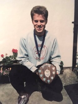 Richard Ferris holding the Club Championship shield