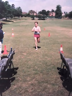 Richard Ferris crossing finish line to win the Club Championship