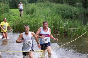 Members running through river at 2008 Elstead Marathon