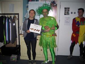 Helen Bracey presents Craig Tate-Grimes with 1st fancy dress prize at the 2020 Club Handicap