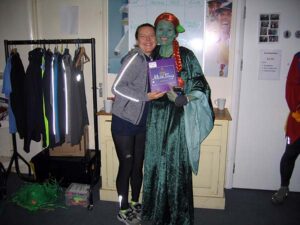 Helen Bracey presents Georgi Welch with her 2nd in fancy dress prize at the 2020 Club Handicap
