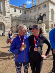 Sarah Hill and Gabriella Hitchcock, looking happy with their medals after the 2021 London Marathon