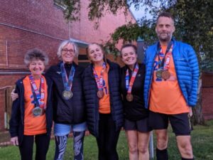 Some of the runners back in Farnham with their medals after the the 2021 London Marathon - Linda Tyler, Sarah Hill, BIlly McCulloch, Jane Probett, Rob Gilchrist