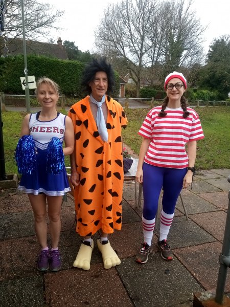Cheer Leader, Kate Townsend with Fred Flintstone, Howard Inns and Whare's Wally, Clair Bailey in fancy dress at the 2021 Club Handicap