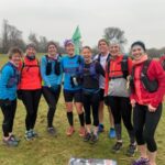 Eight runners kitted out for their 13 mile training run home from the 2022 SXCL Chawton House