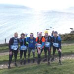 2022 Grizzly - Sue Taylor, Linda Tyler, Kate Townsend, Clair Bailey, Lina Haines, and Bridget Naylor on the cliff tops