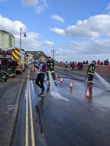 2022 Grizzly - Sue Taylor getting a hosedown by a fireman after the race