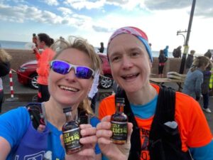 2022 Grizzly - Kate Townsend (left) and Clair Bailey with their bottles of Grizzly rum after the race