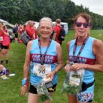 Carol Dare and Kay Copeland with finishing goodies at the 2022 Alresford 10km