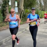 Craig Tate-Grimes paces Becky Martin in the 2022 Fleet Half Marathon