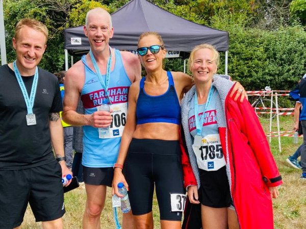 Four of the Farnham Runners Pilgrims marathoners recover after the 2022 race