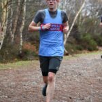Sam Angell running in the 2022-23 SXCL Bourne Woods cross-country in Farnham