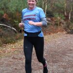 Julia Jones running in the 2022-23 SXCL Bourne Woods cross-country in Farnham