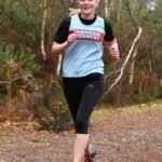Lina Haines running in the 2022-23 SXCL Bourne Woods cross-country in Farnham