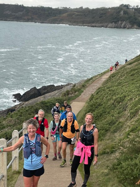 Linda Tyler, Chris Raby, Louise Granell, Justin Clarke and Sue Taylor stopping for a breather on a gruelling uphill section during the 2022 Gower Runs