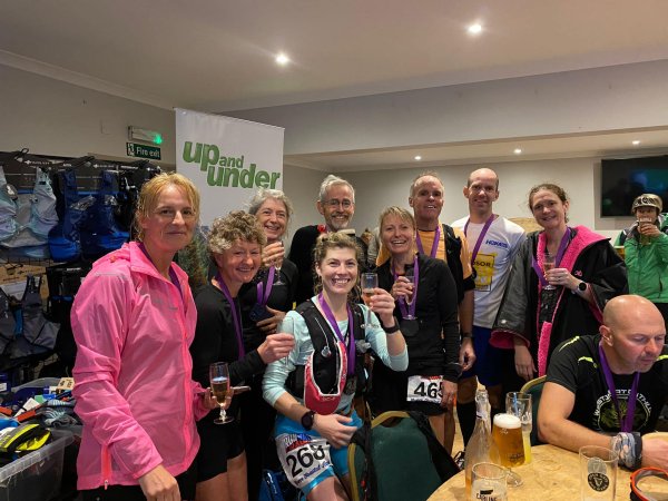The Farnham Runners contingent with celebratory drinks after the 2022 Gower Runs