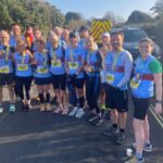 Farnham Runners group with their medals having completed the 2022 HRRL Gosport half marathon