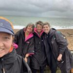 Nicola O'Connor, Penny Schnabel, Linda Tyler and Louise Granell on the beach after the 2022 Hayling 10