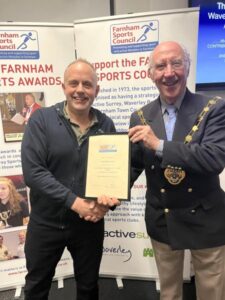 Craig Tate-Grimes being presented with the Oustanding Contribution To Sport Award by the Mayor of Waverley at the 2023 Farnham Sports Awards