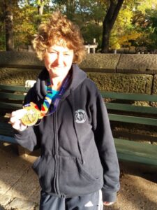 Linda Tyler after the 2016 New York Marathon with her medal