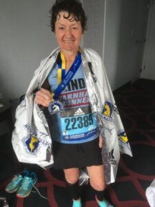 Linda Tyler after the 2019 Boston Marathon with her medal