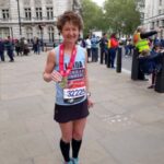 Linda Tyler after the 2019 London Marathon with her medal
