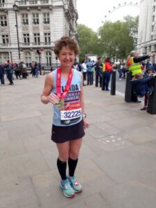Linda Tyler after the 2019 London Marathon with her medal