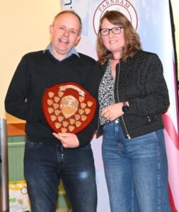 Club chairman Nicola O'Connor presenting Craig Tate-Grimes with the Steve Parker Award at the 2022-23 Farnham Awards Dinner