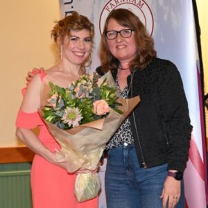 Organiser of the evening, Louise Granell, presented with flowers at the 2022-23 Farnham Awards Dinner