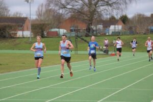 Emma Pearson and Tony Jones pacing each other to the finish line of the 2023 Salisbury 10