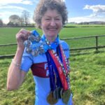Linda Tyler with her individual marathons and World Marathon Majors medal