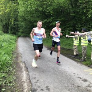 James Clarke overtaking another runner in the 2023 Alton 10