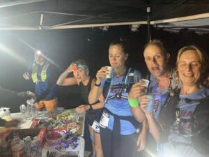 Farnham Runners team at one of the food stations during the 2023 Midnight Marathon