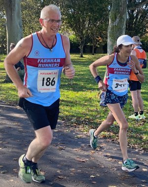 Two runners wearing 2024 club running vests