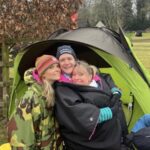 Gemma Whitehouse, Clair Bailey and Kate Townsend at the 2025 SXCL race at Chawton House huddling together to keeping warm after the race