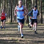 Colin Addison running the the woods at the 2024-25 SXCL Bourne Green cross-country