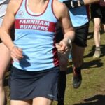 Leza Milligan and Charles Ashby running the the woods at the 2024-25 SXCL Bourne Green cross-country