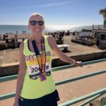 Georgie Abrook with her finishers medal after the 2025 Brighton Marathon