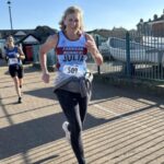 Julia Tagg finishing strongly at the 2025 HRRL Ryde 10