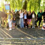 Group comprising two Farnham Runners finishers and supporters in Farnham after the 2025 London Marathon